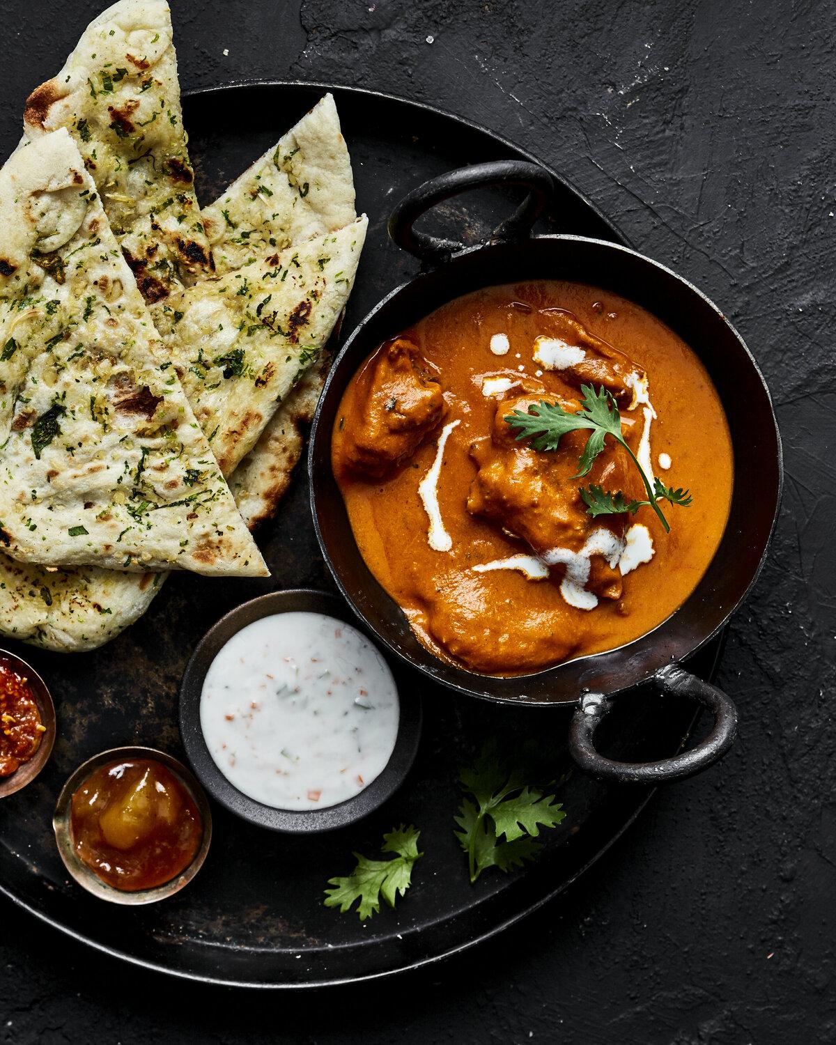 Butter chicken with fresh garlic naan